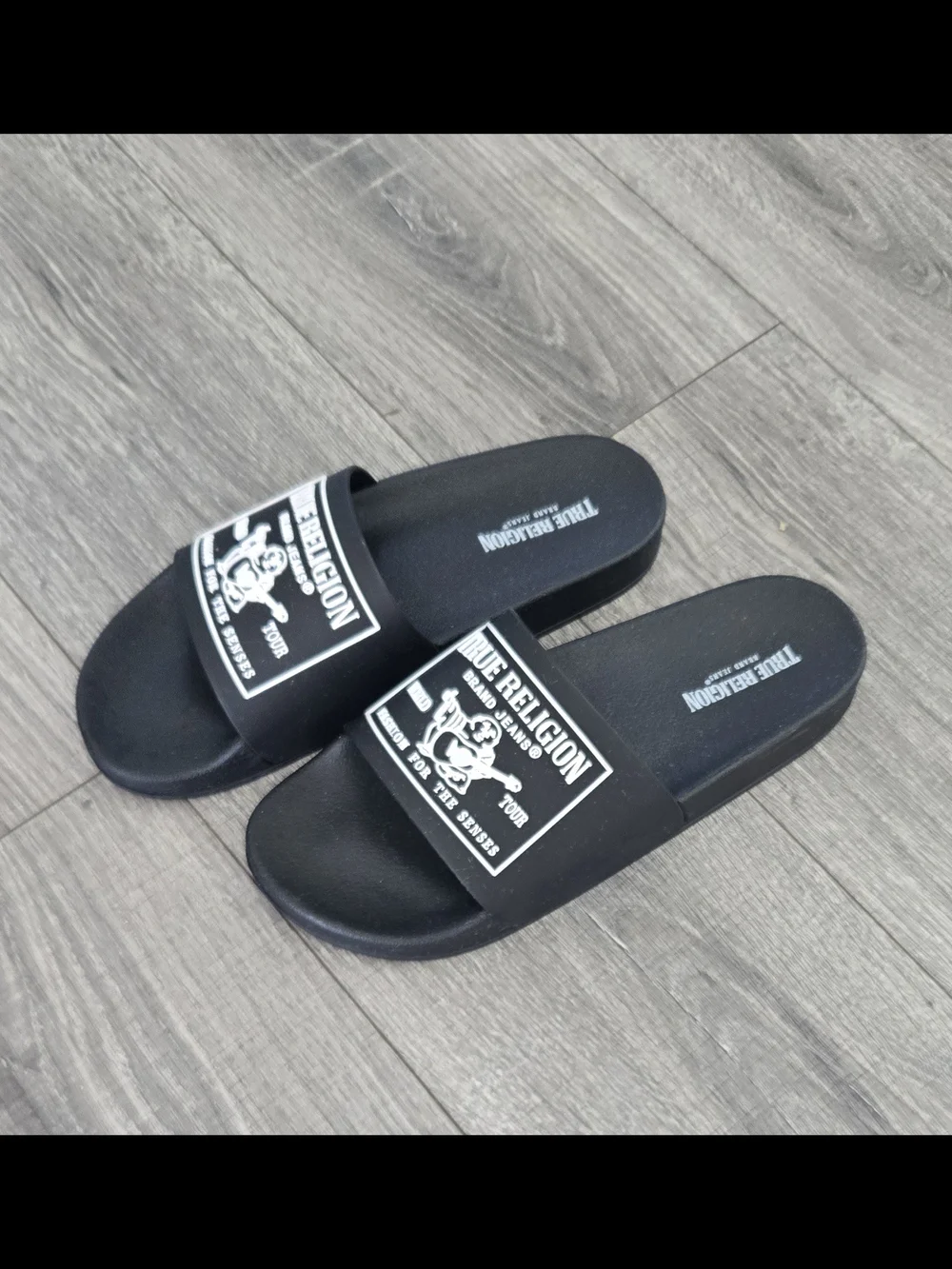 NWOT True Religion black slide sandals in men’s US size 9.
